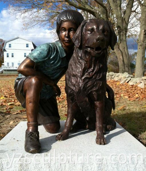 bronze boy and dog statue
